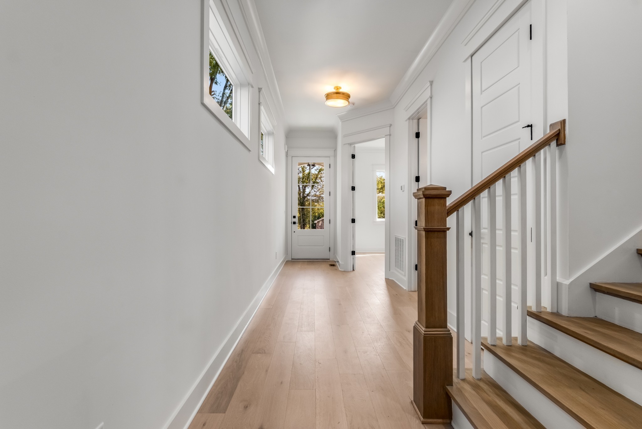 1408 Lischey Avenue, Unit C Nashville, TN 37207 - Photo 4 of 29 a view of a hallway with wooden floor and staircase