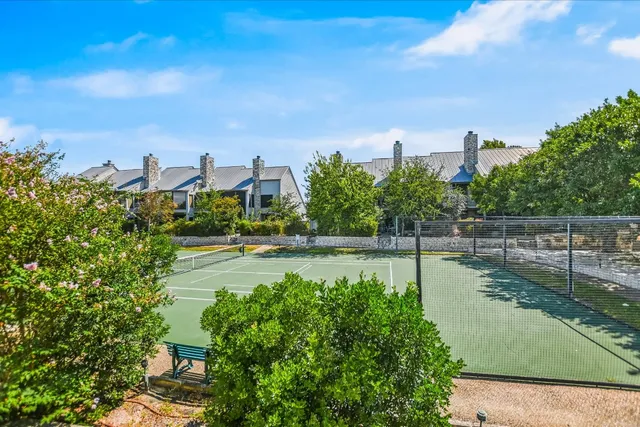 a view of a lake with houses in the back
