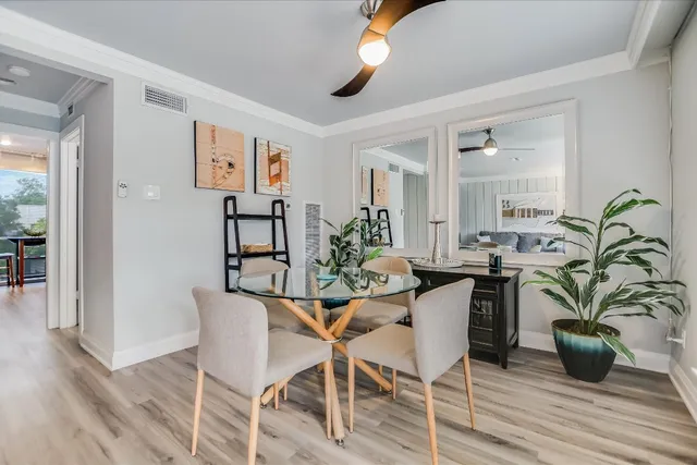 a view of a dining room with furniture and wooden floor