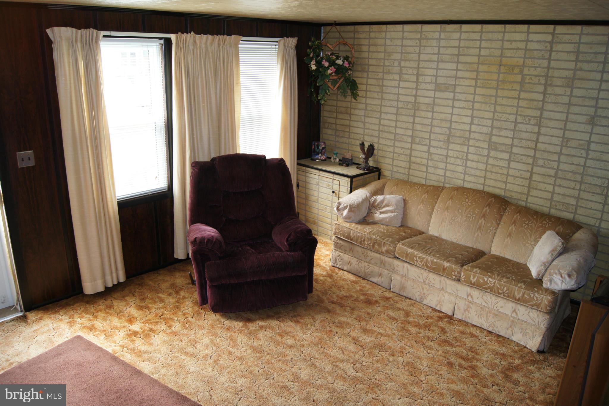 1906 Searles Road Baltimore, MD 21222 - Photo 3 of 13 a living room with furniture and a window