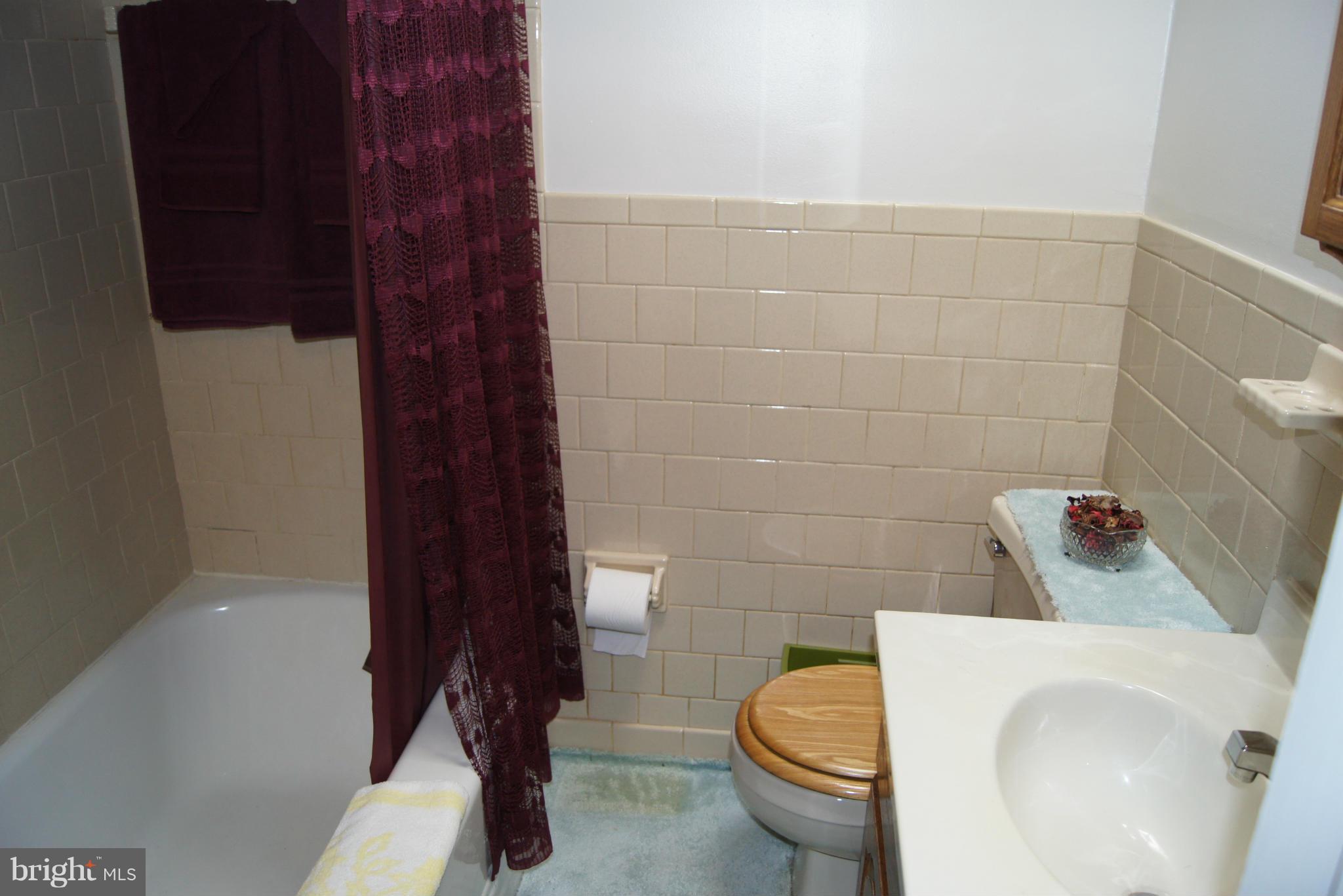 1906 Searles Road Baltimore, MD 21222 - Photo 9 of 13 a bathroom with a toilet and a sink