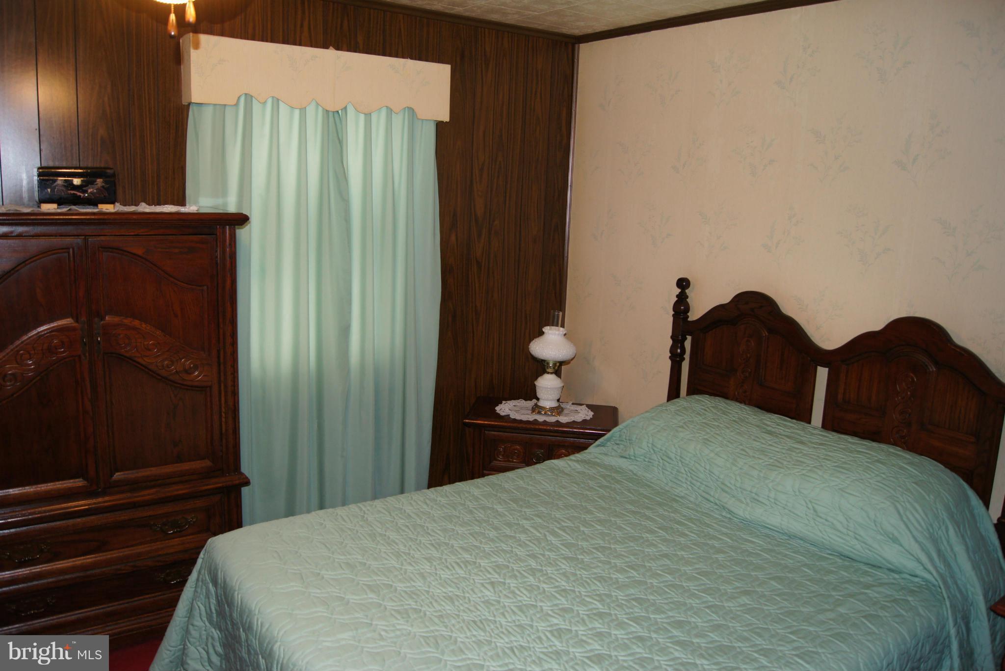 1906 Searles Road Baltimore, MD 21222 - Photo 10 of 13 a bedroom with a bed and a closet