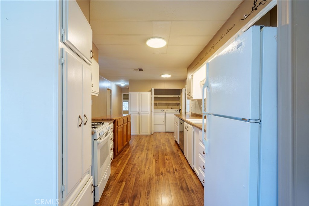 4000 Pierce Street, Unit 72 Riverside, CA 92505 - Photo 9 of 20 a view of a kitchen with a refrigerator and a stove