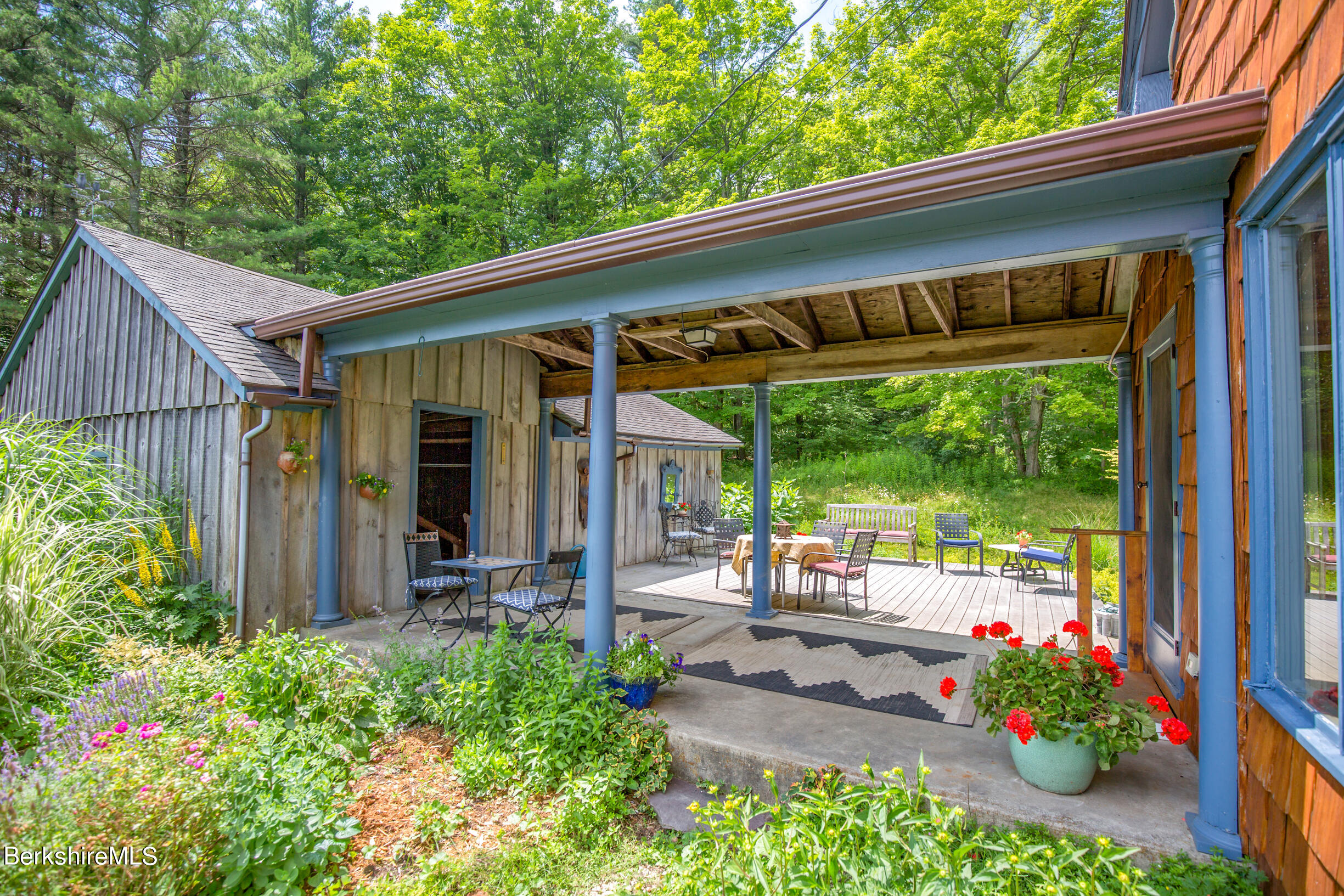 103 Patton Road Richmond, MA 01254 - Photo 24 of 37 a view of a porch with furniture and garden