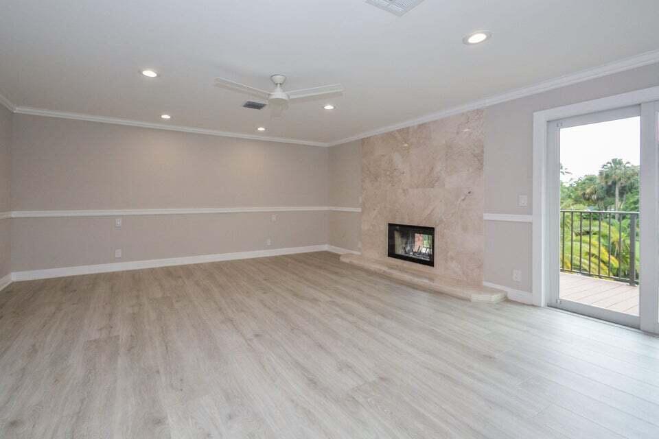 934 Southwest 21st Way Boca Raton, FL 33486 - Photo 13 of 25 an empty room with wooden floor and windows