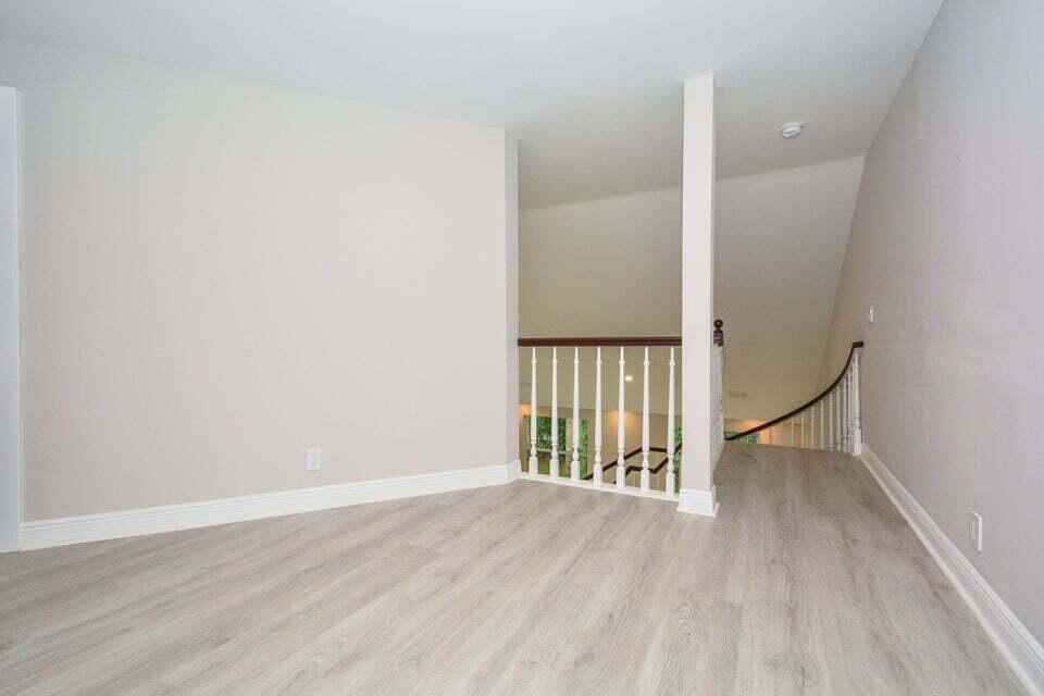 934 Southwest 21st Way Boca Raton, FL 33486 - Photo 21 of 25 a view of an empty room with wooden floor and a window