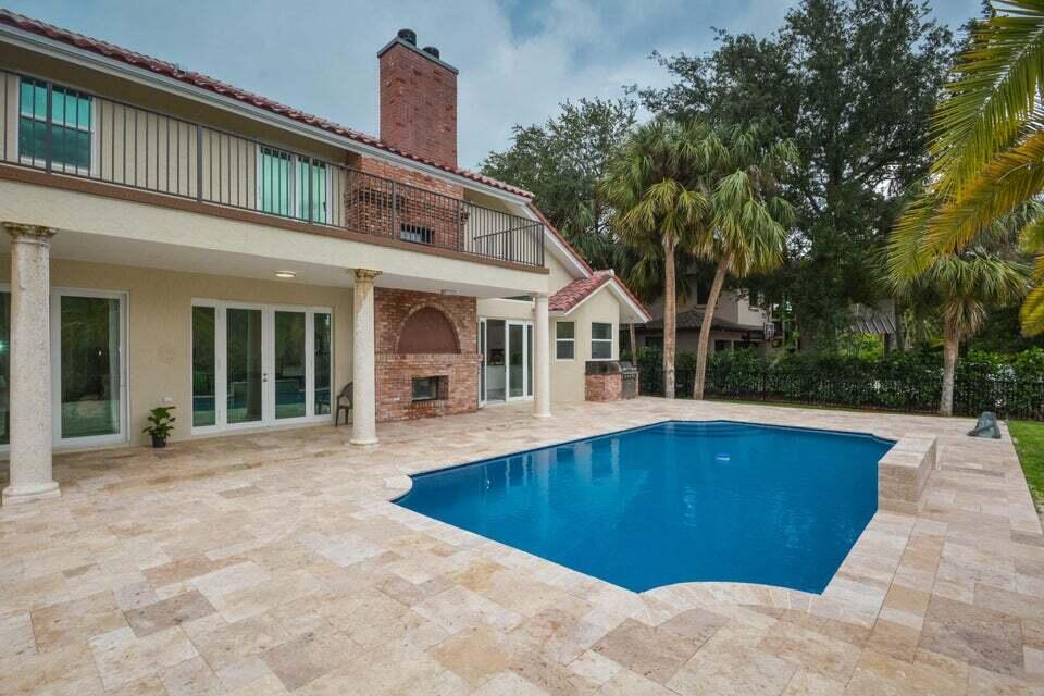 934 Southwest 21st Way Boca Raton, FL 33486 - Photo 22 of 25 a front view of house with yard nad seating space