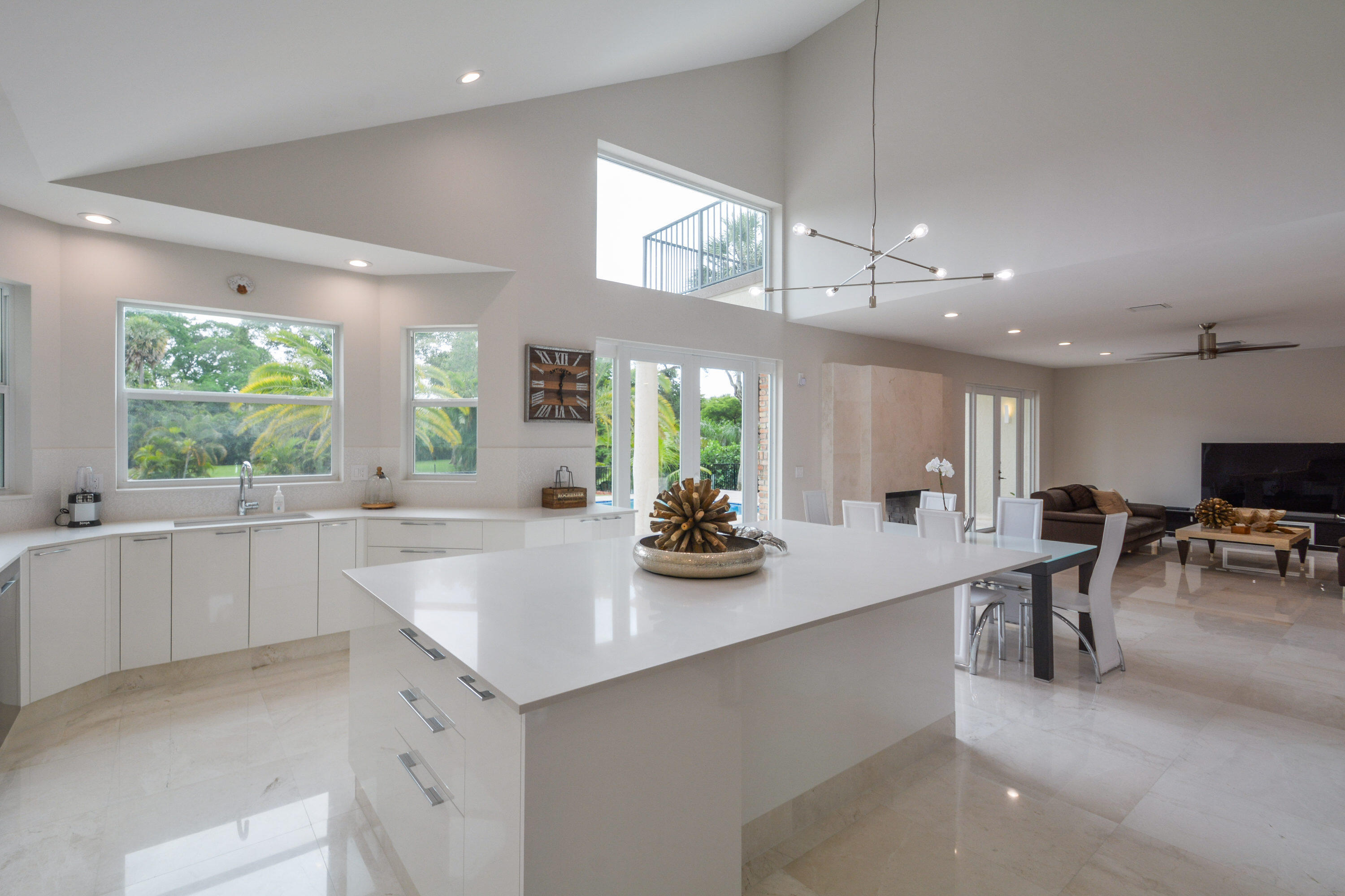 934 Southwest 21st Way Boca Raton, FL 33486 - Photo 4 of 25 a view of a kitchen and dining area with windows