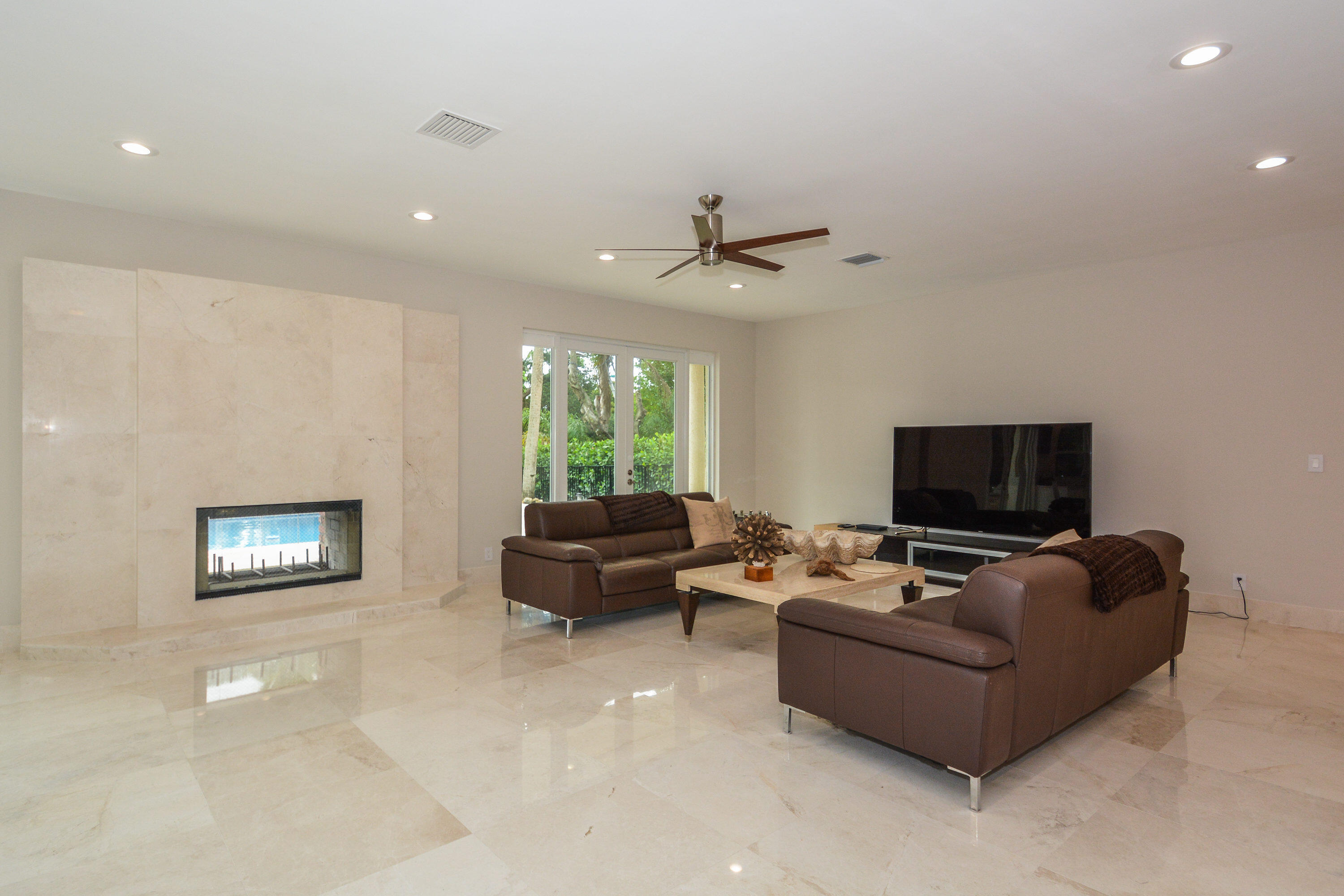 934 Southwest 21st Way Boca Raton, FL 33486 - Photo 5 of 25 a living room with furniture and a flat screen tv