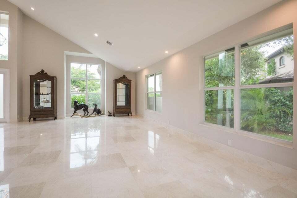 934 Southwest 21st Way Boca Raton, FL 33486 - Photo 8 of 25 a view of a big room with windows and potted plants