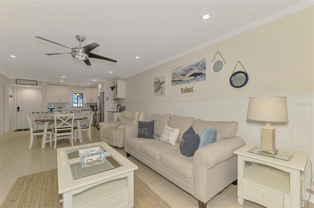 1612 Stickney Point Road, Unit 16121 Sarasota, FL 34231 - Photo 17 of 39 a living room with furniture and a table