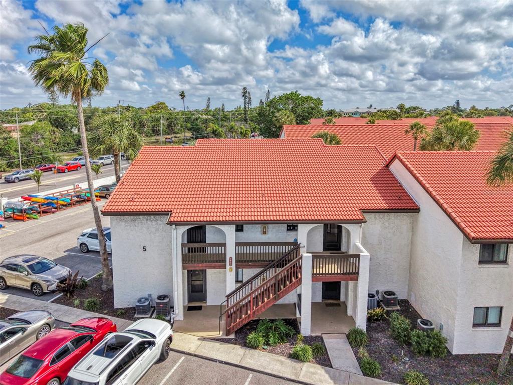 1612 Stickney Point Road, Unit 16121 Sarasota, FL 34231 - Photo 2 of 39 a aerial view of a house with a yard