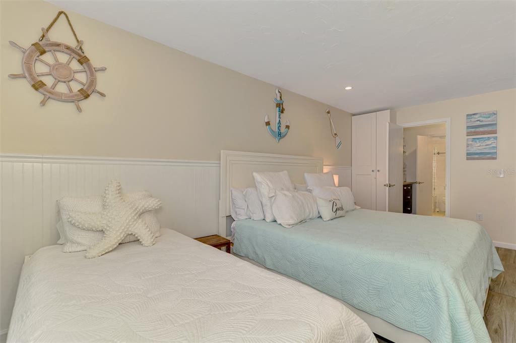 1612 Stickney Point Road, Unit 16121 Sarasota, FL 34231 - Photo 22 of 39 a bedroom with a bed and a window