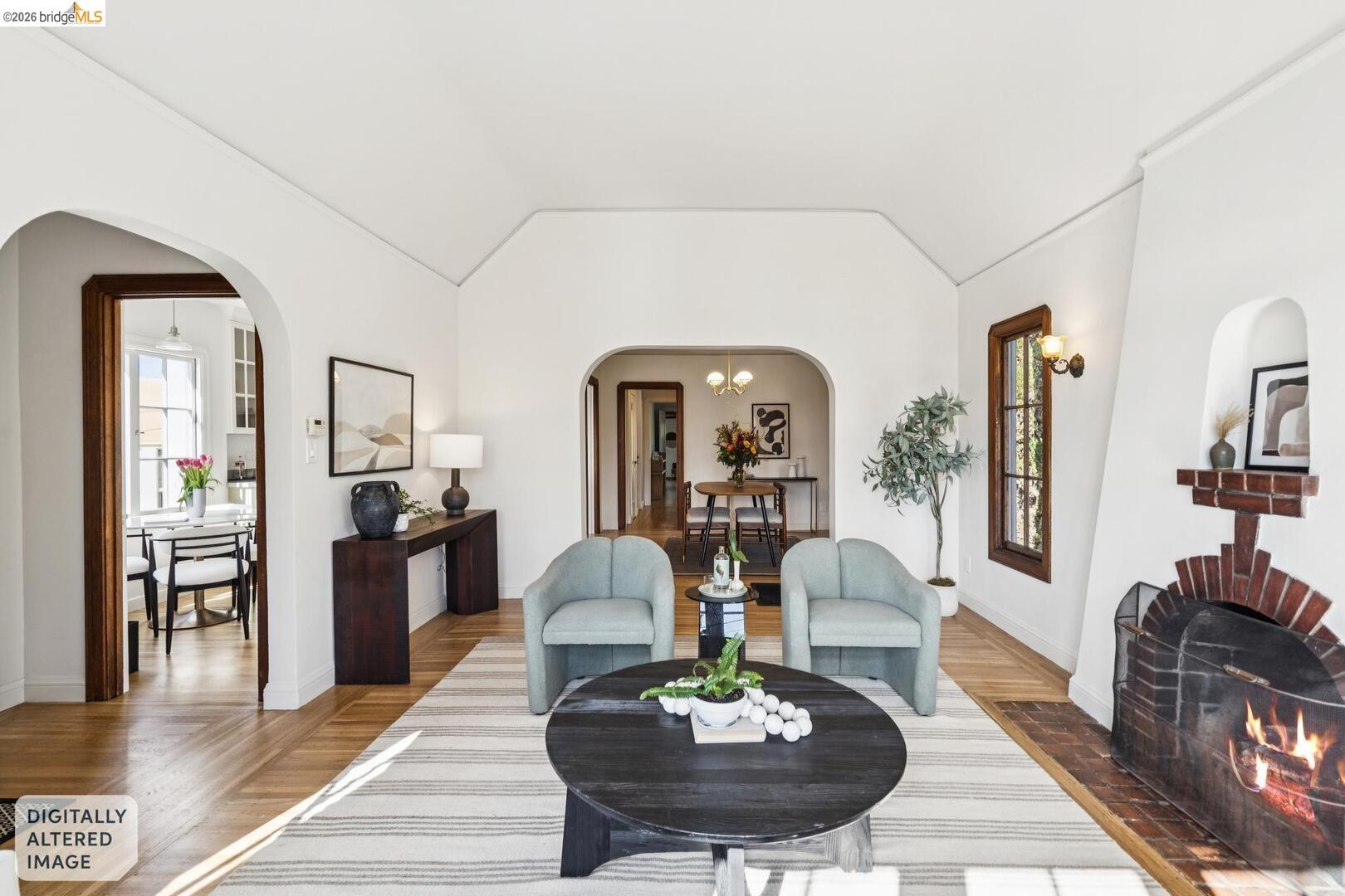 4107 Lyman Road Oakland, CA 94602 - Photo 14 of 57 Living area with wood finished floors, healthy amount of natural light, and vaulted ceiling