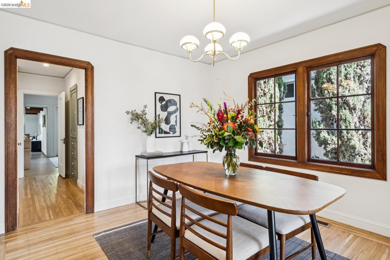 4107 Lyman Road Oakland, CA 94602 - Photo 17 of 57 Living room featuring vaulted ceiling, light wood finished floors, and arched walkways