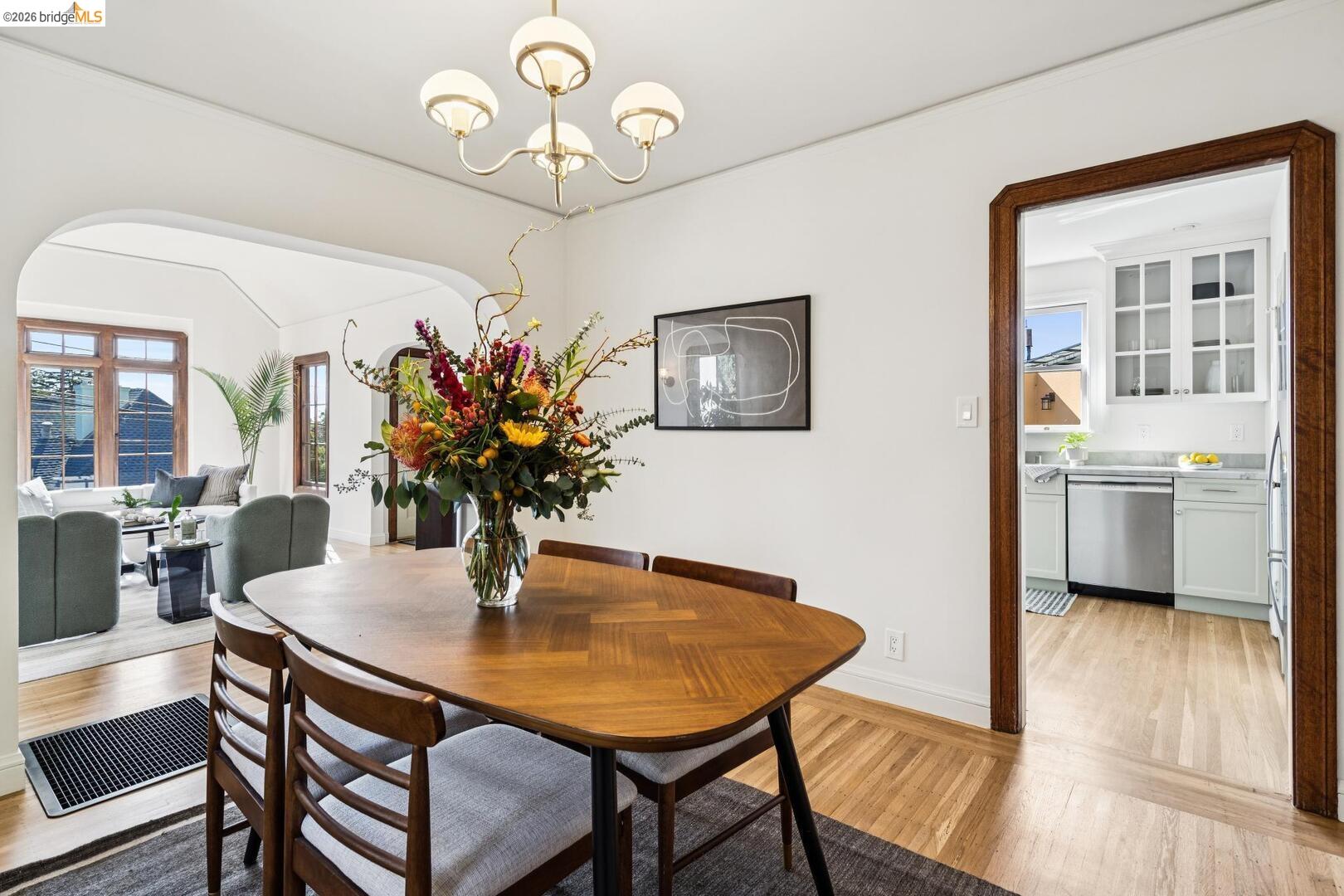 4107 Lyman Road Oakland, CA 94602 - Photo 19 of 57 Kitchen featuring glass fronted cabinets, white cabinetry, and stainless steel dishwasher