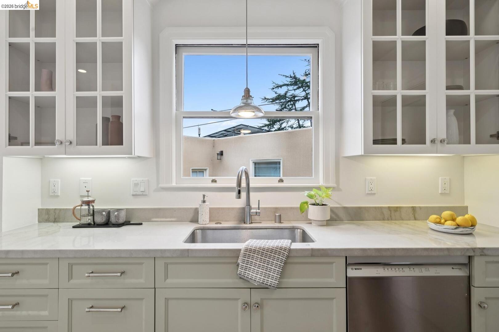 4107 Lyman Road Oakland, CA 94602 - Photo 21 of 57 Living room featuring vaulted ceiling, light wood finished floors, and arched walkways