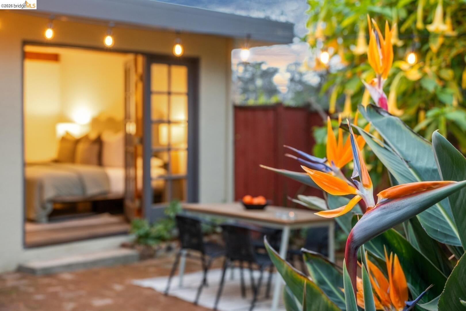 4107 Lyman Road Oakland, CA 94602 - Photo 29 of 57 Bedroom featuring french doors, access to exterior, beamed ceiling, and tile patterned floors