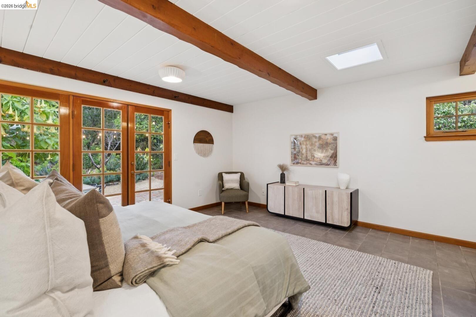4107 Lyman Road Oakland, CA 94602 - Photo 31 of 57 Bedroom featuring french doors, access to exterior, beamed ceiling, and tile patterned floors