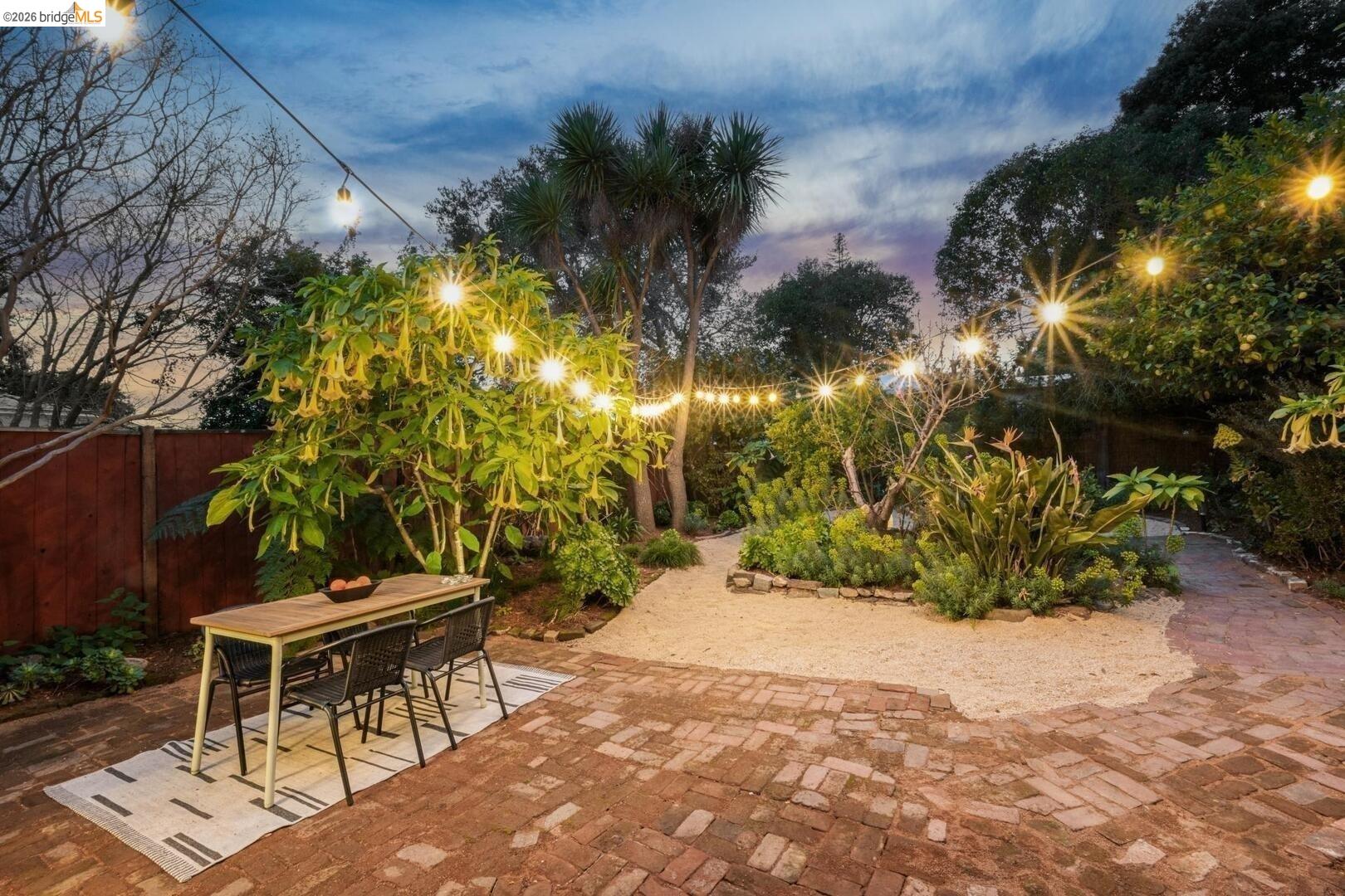 4107 Lyman Road Oakland, CA 94602 - Photo 48 of 57 Living area with arched walkways, light wood-style flooring, and lofted ceiling