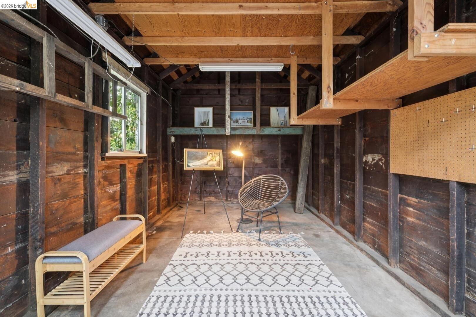 4107 Lyman Road Oakland, CA 94602 - Photo 56 of 57 Living area with arched walkways, light wood-style flooring, and lofted ceiling