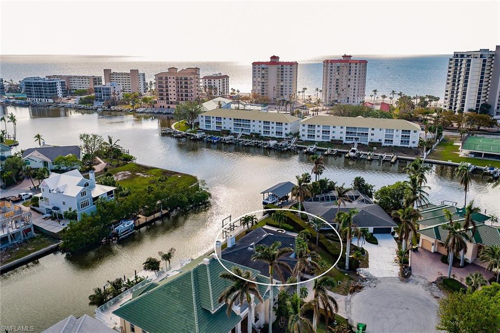 128 Heron Avenue Naples, FL 34108 - Photo 11 of 12 a view of a city and lake