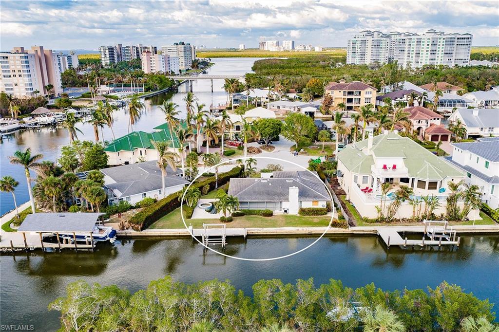 128 Heron Avenue Naples, FL 34108 - Photo 4 of 12 a view of a city with water view