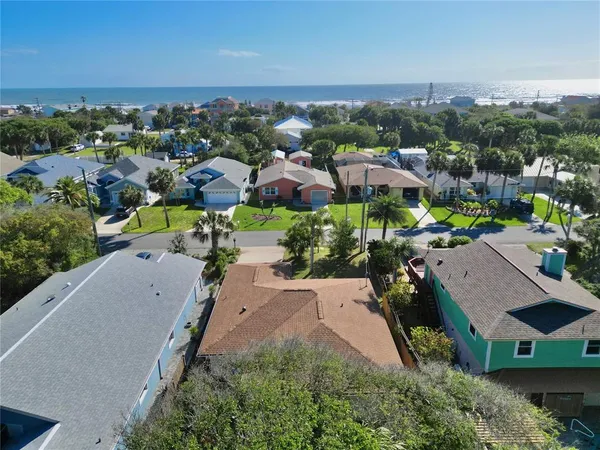 an aerial view of a house with a garden