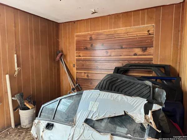 a view of walk in closet with clothes
