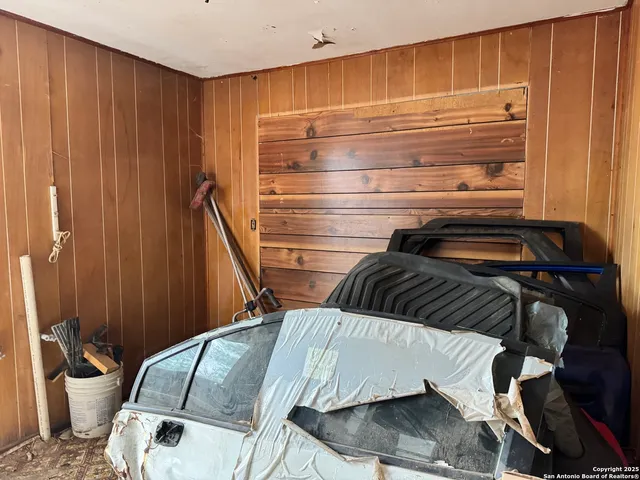a view of walk in closet with clothes