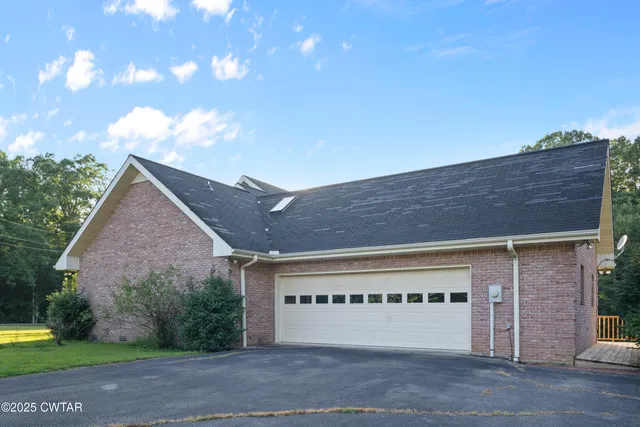 a view of a house with a big yard