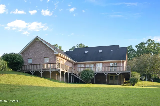 a view of a room with lots of windows and chandelier