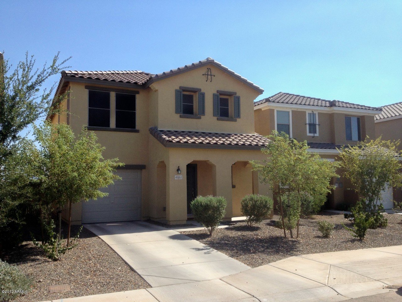 6351 West Beverly Road Laveen, AZ 85339 - Photo 1 of 12 a front view of a house with yard