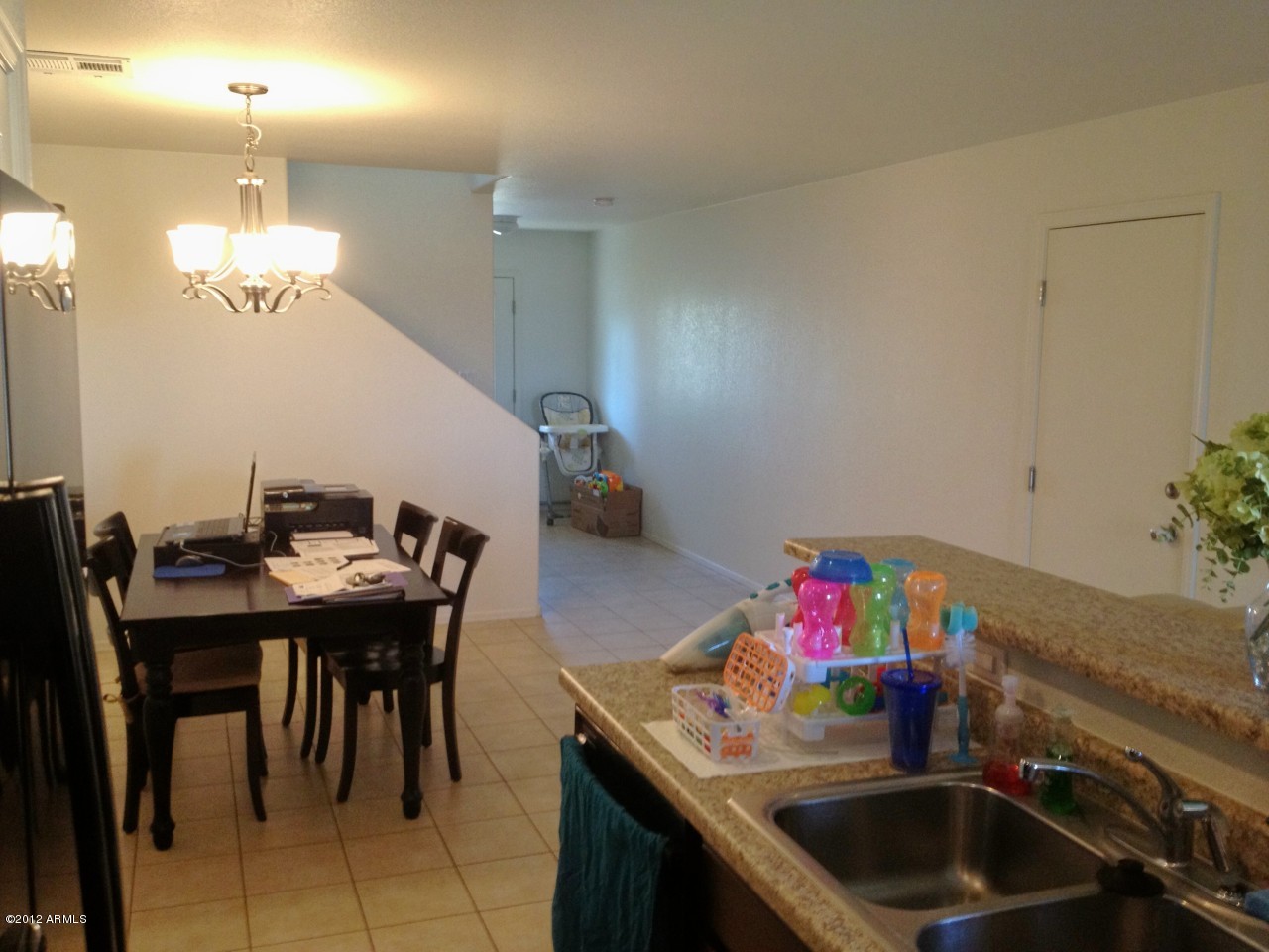 6351 West Beverly Road Laveen, AZ 85339 - Photo 2 of 12 a kitchen with a table and chairs in it