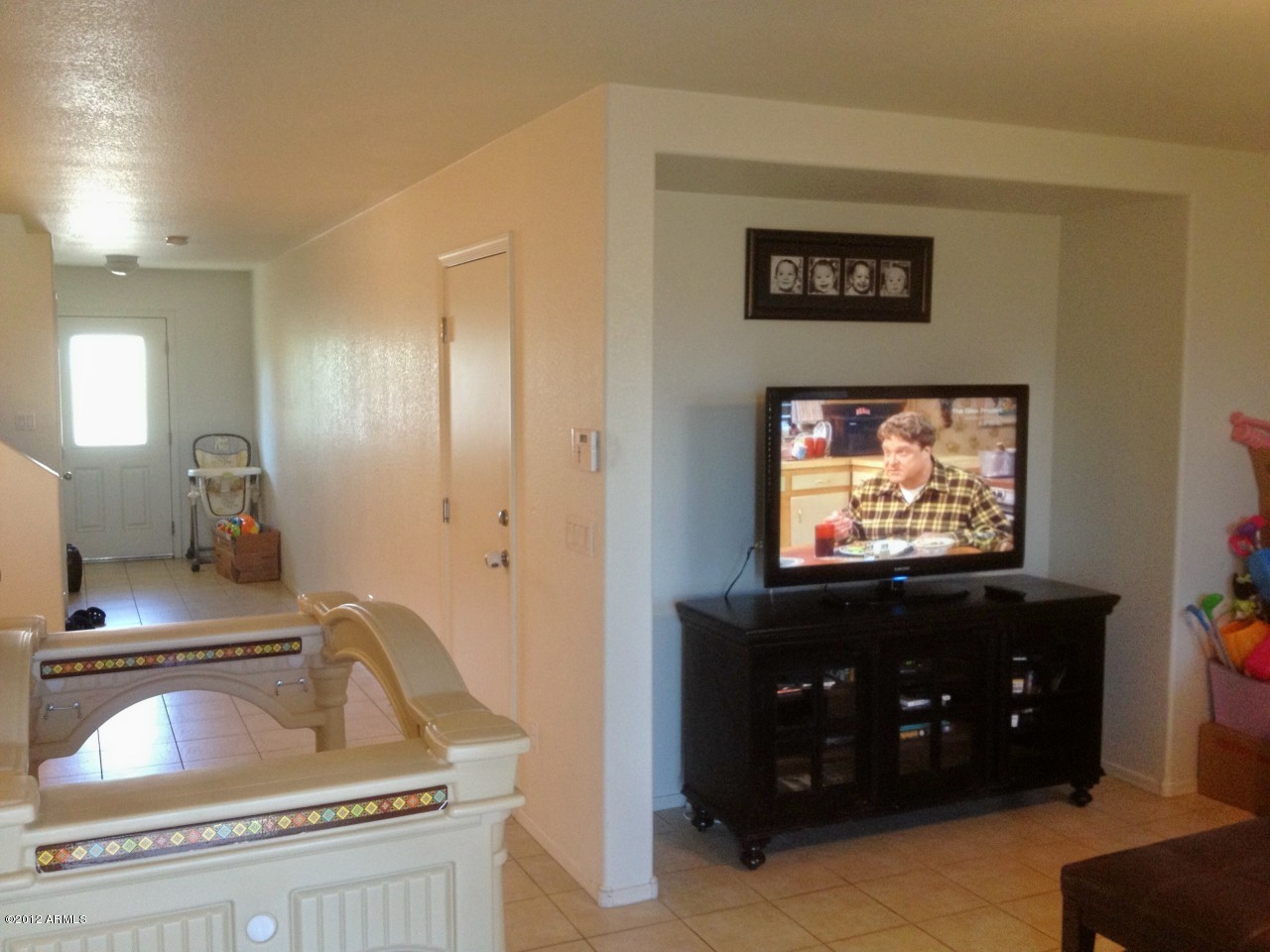 6351 West Beverly Road Laveen, AZ 85339 - Photo 6 of 12 a living room with furniture and a flat screen tv