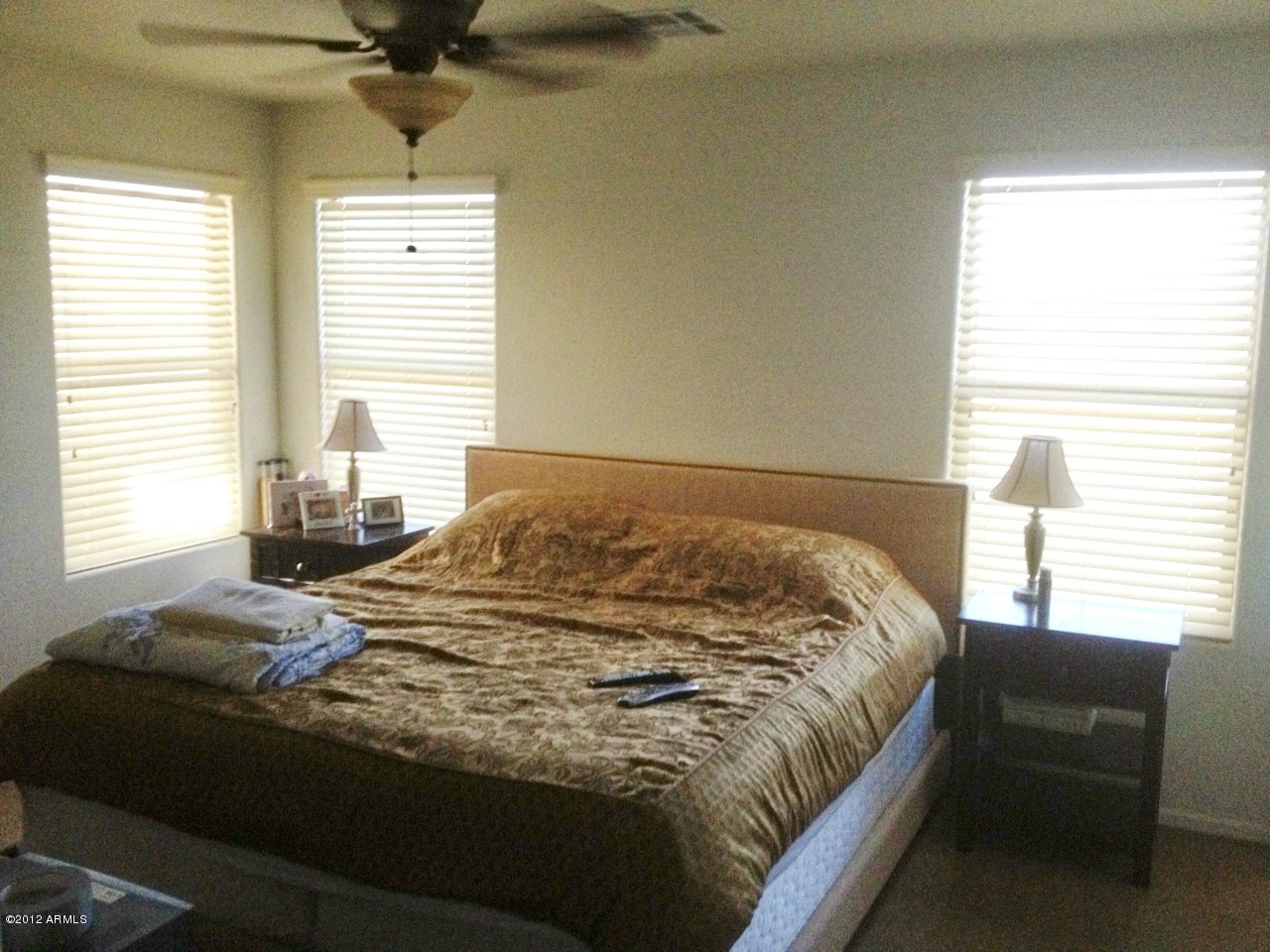 6351 West Beverly Road Laveen, AZ 85339 - Photo 8 of 12 a bedroom with a bed and window