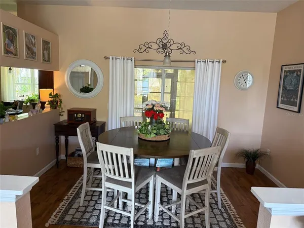 a dining room with furniture a livingroom and chandelier
