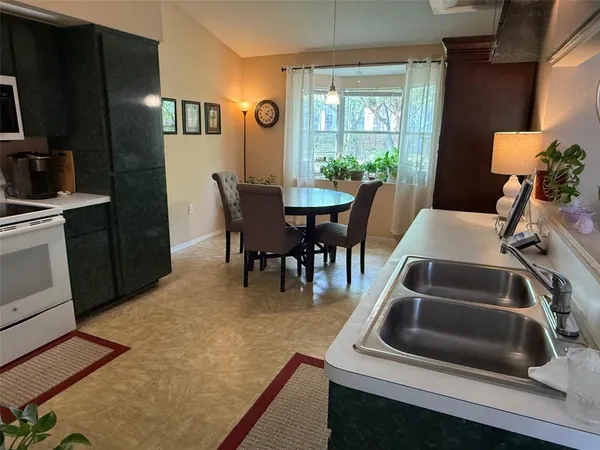a view of a dining room with furniture window and outside view