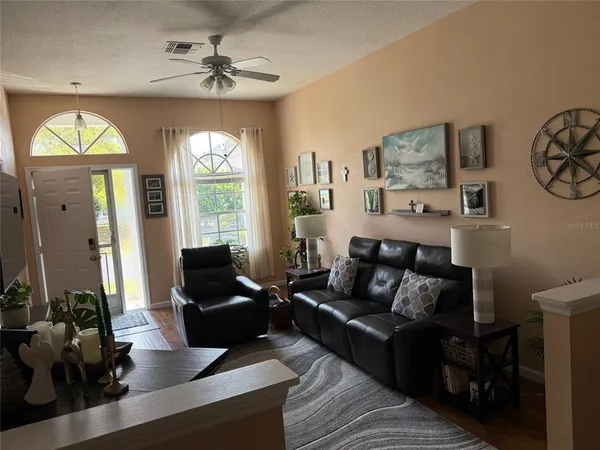 a living room with furniture and a large window