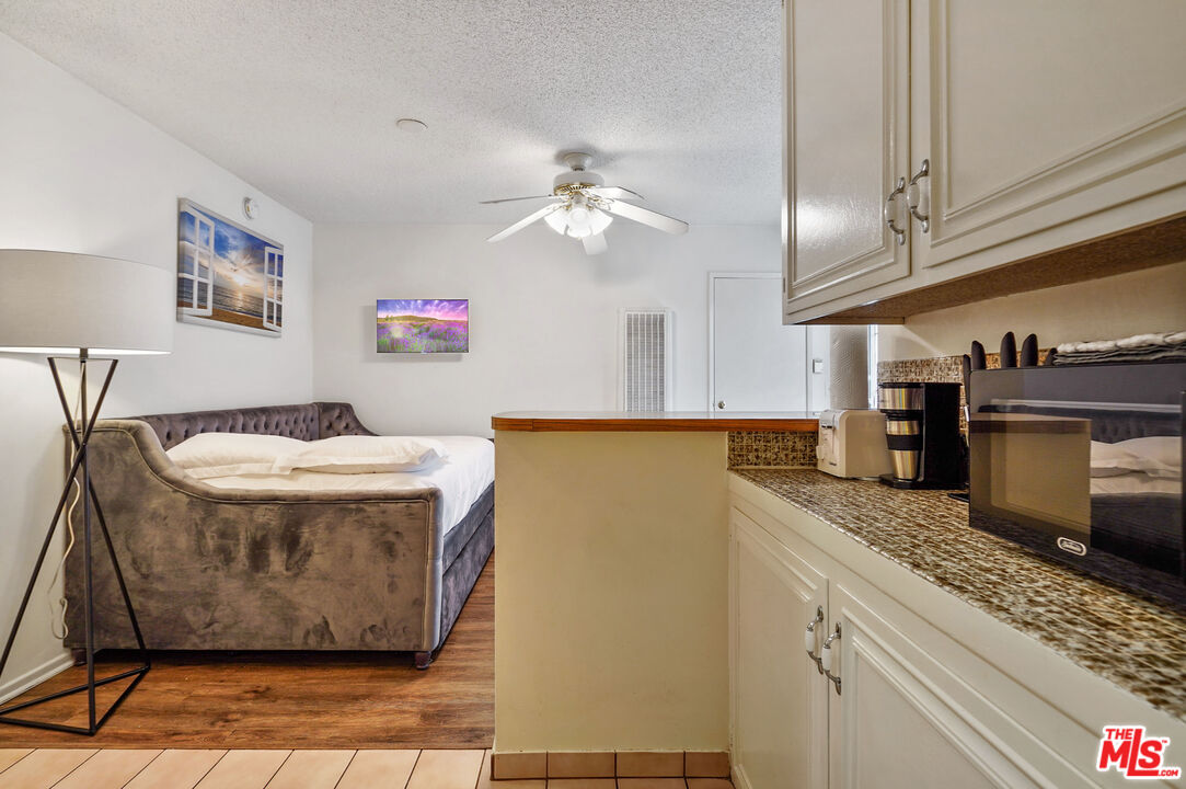 3720 Vinton Avenue, Unit 1A Los Angeles, CA 90034 - Photo 11 of 15 a view of a kitchen with a sink and cabinets