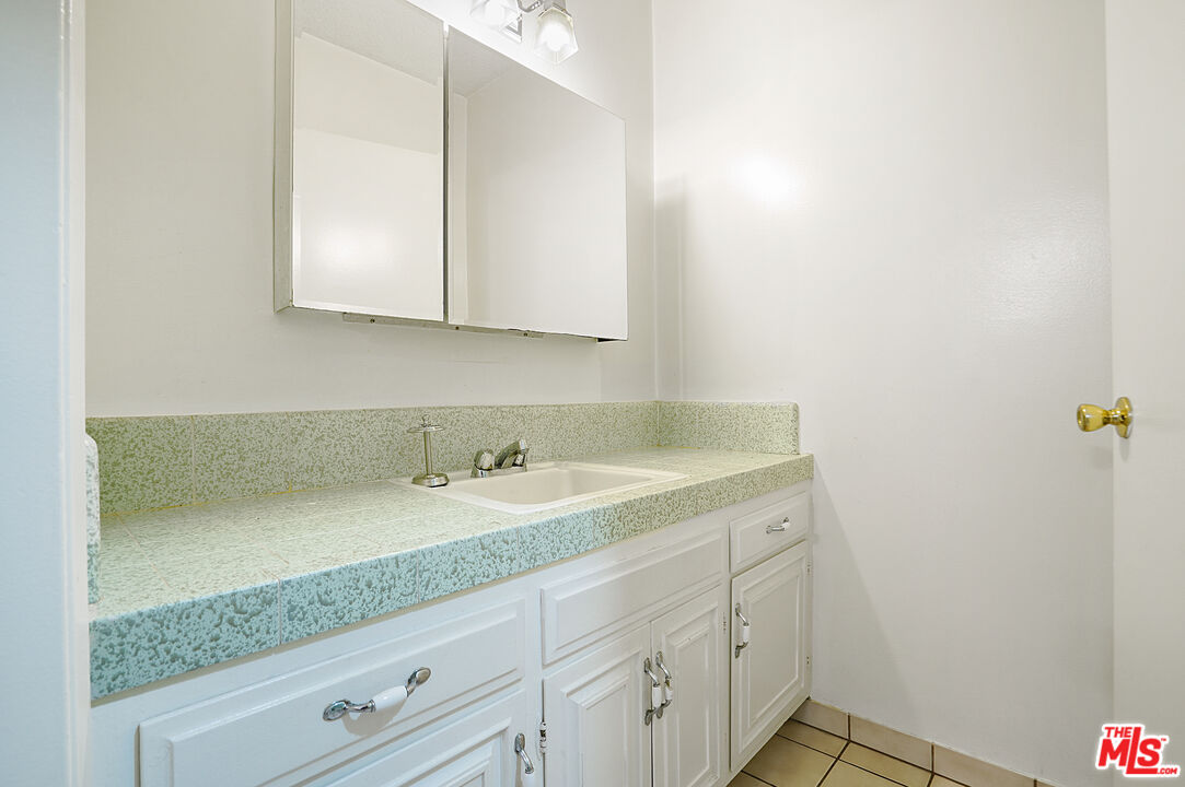 3720 Vinton Avenue, Unit 1A Los Angeles, CA 90034 - Photo 8 of 15 a bathroom with a sink and a mirror