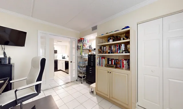 a view of a hallway with furniture and window