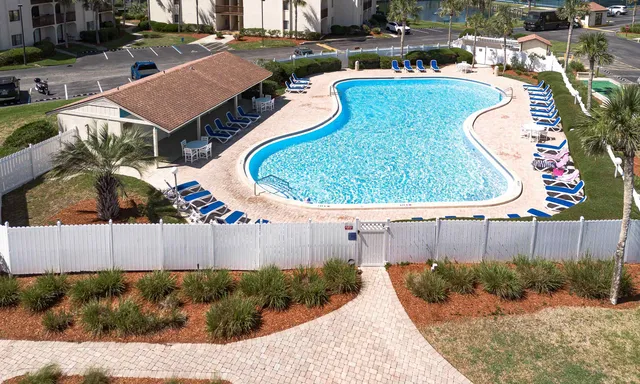 a view of swimming pool with a balcony