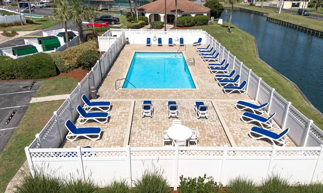 an aerial view of residential houses with outdoor space