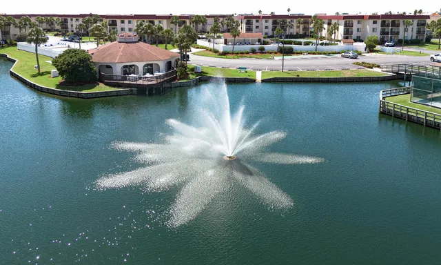 a view of a backyard with sitting area