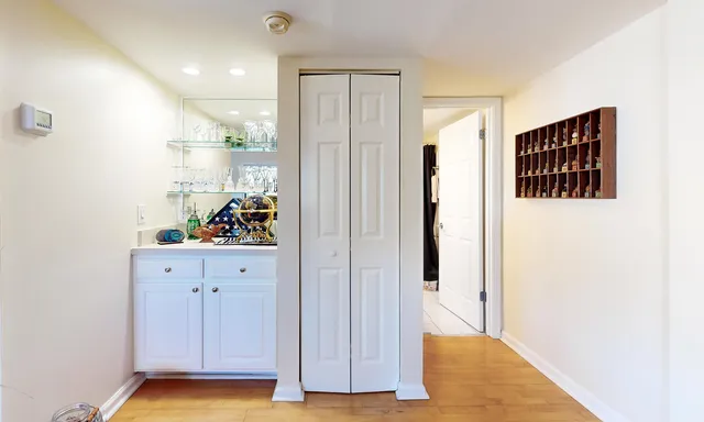 a view of an entryway with wooden floor