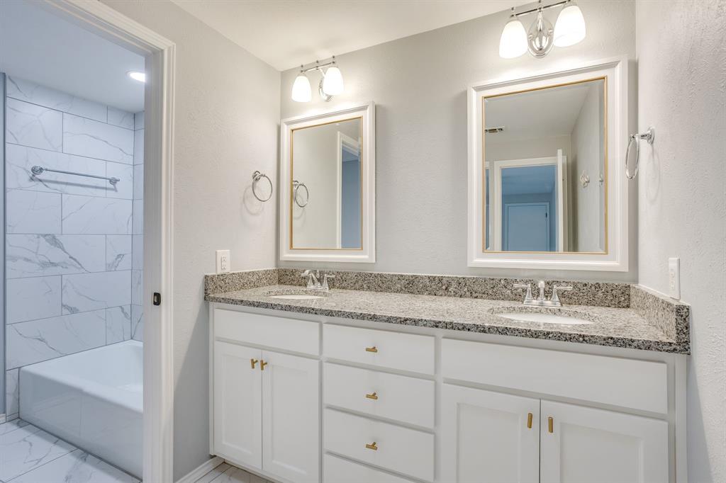 10814 Power Squadron Road Azle, TX 76020 - Photo 20 of 34 a bathroom with a granite countertop sink and a mirror
