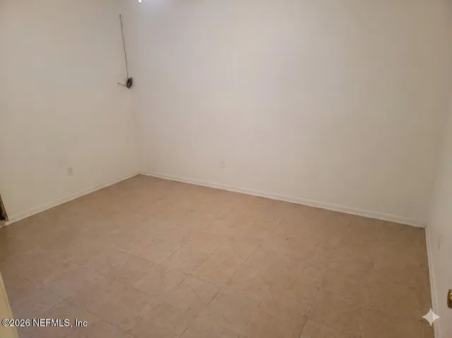 a bedroom with a bed and dresser