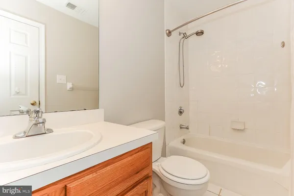 a bathroom with a sink a toilet and a bathtub