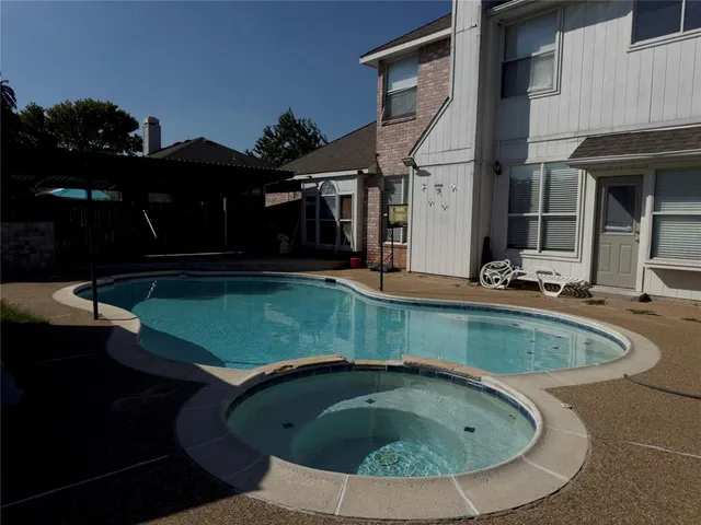 a view of a backyard with hardwood